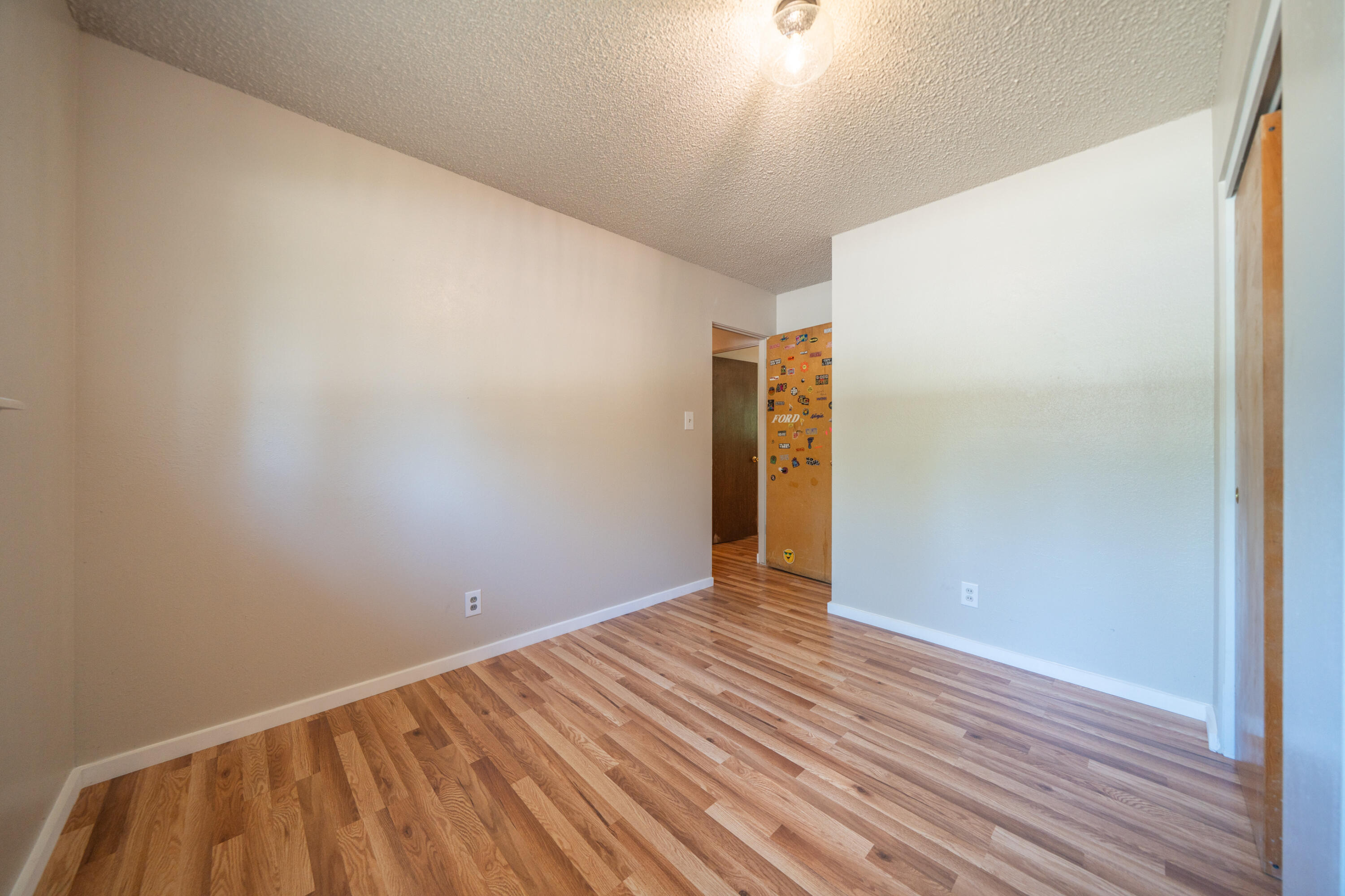 37347 Cypress Avenue Burney, CA 96013 - Photo 27 of 62 a view of an empty room with wooden floor
