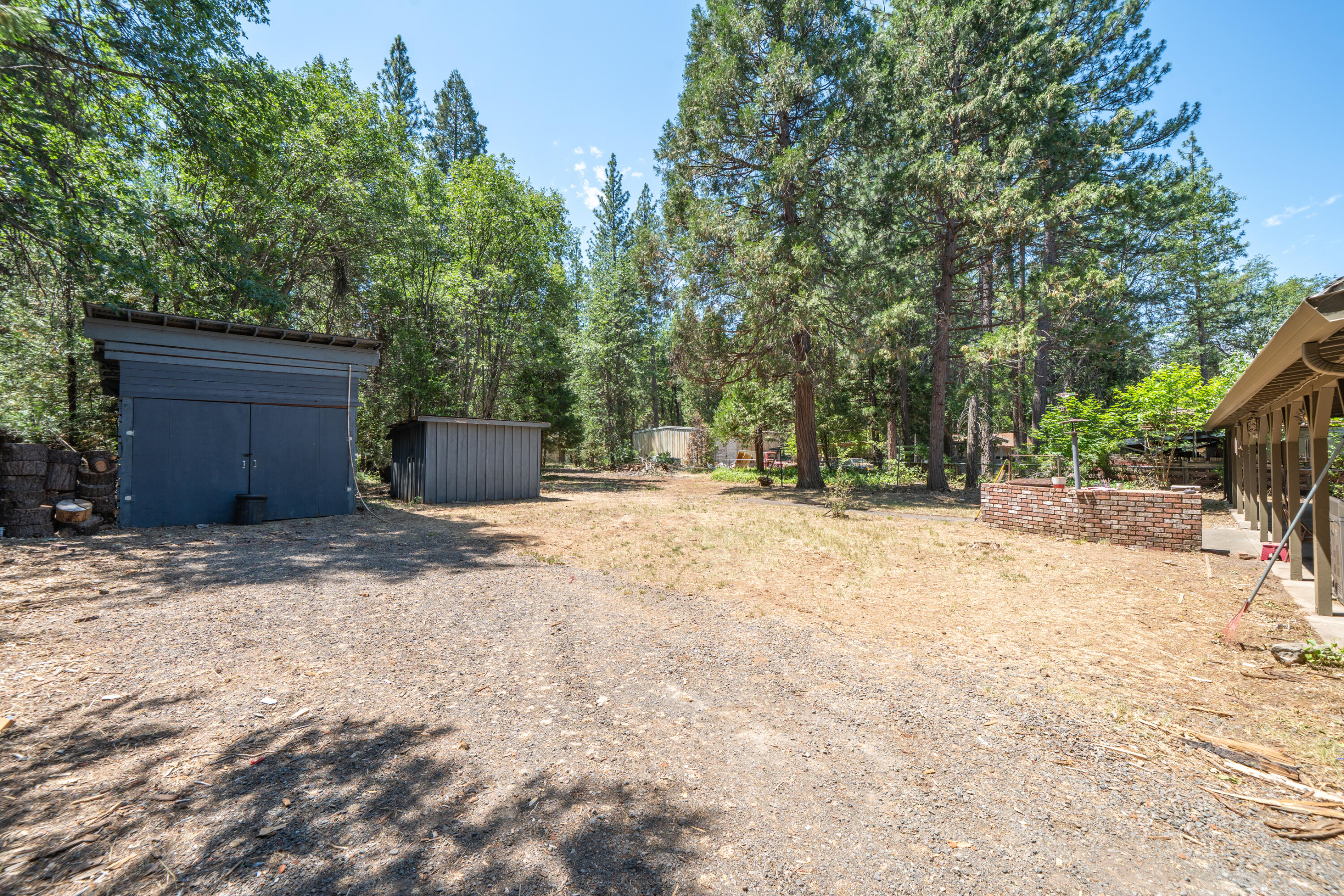 37347 Cypress Avenue Burney, CA 96013 - Photo 39 of 62 a house with trees in front of it