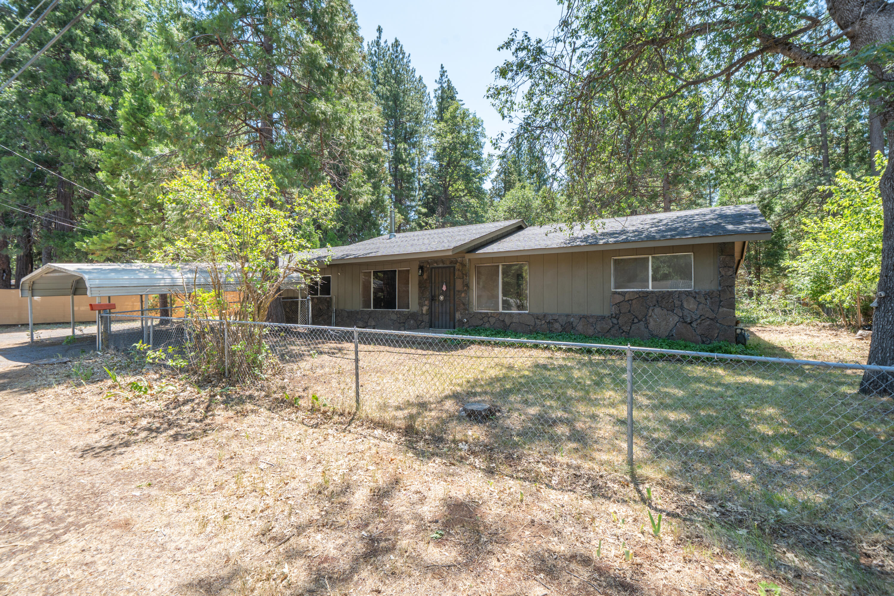 37347 Cypress Avenue Burney, CA 96013 - Photo 4 of 62 a house with trees in the background