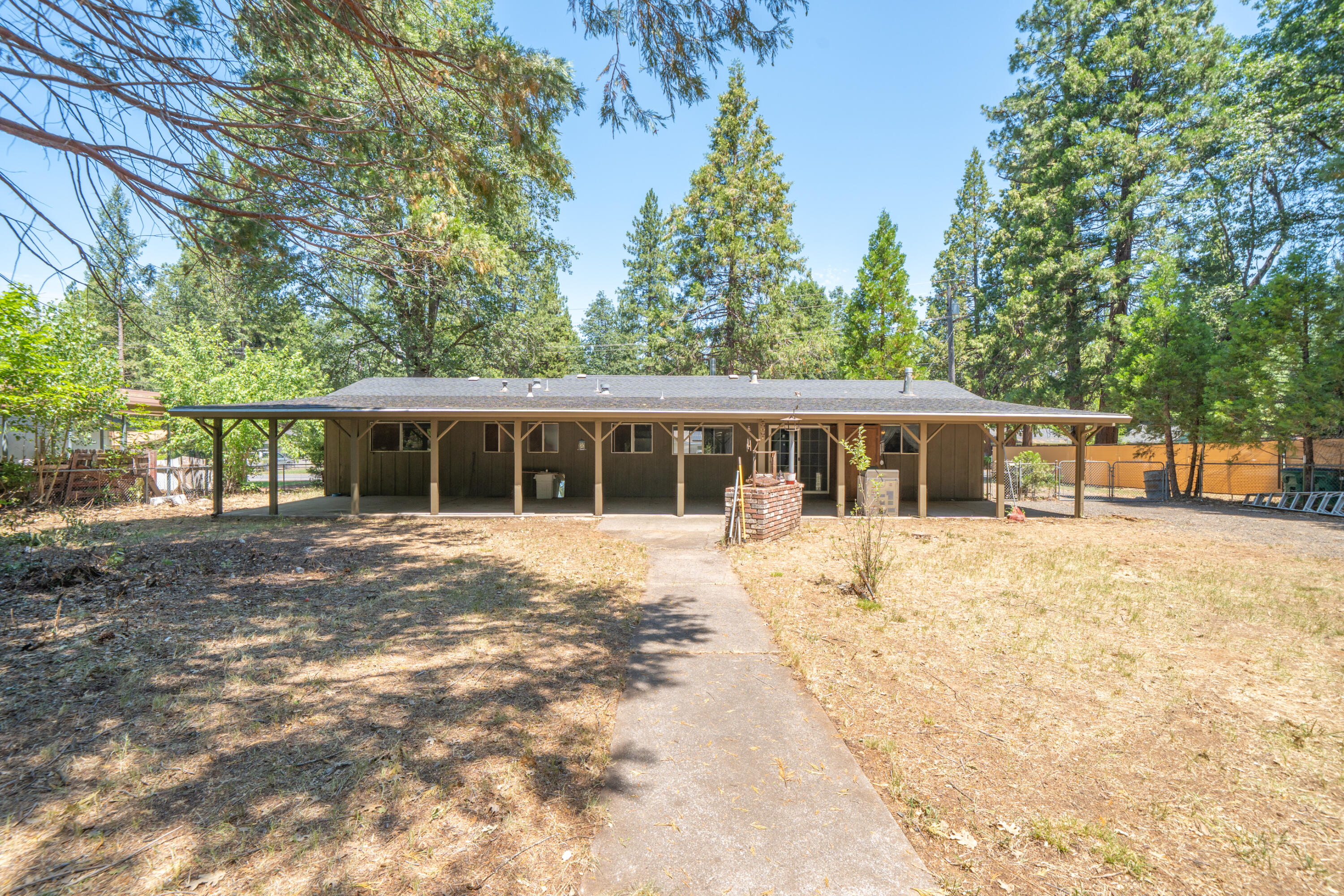 37347 Cypress Avenue Burney, CA 96013 - Photo 43 of 62 a front view of a house with a yard and trees