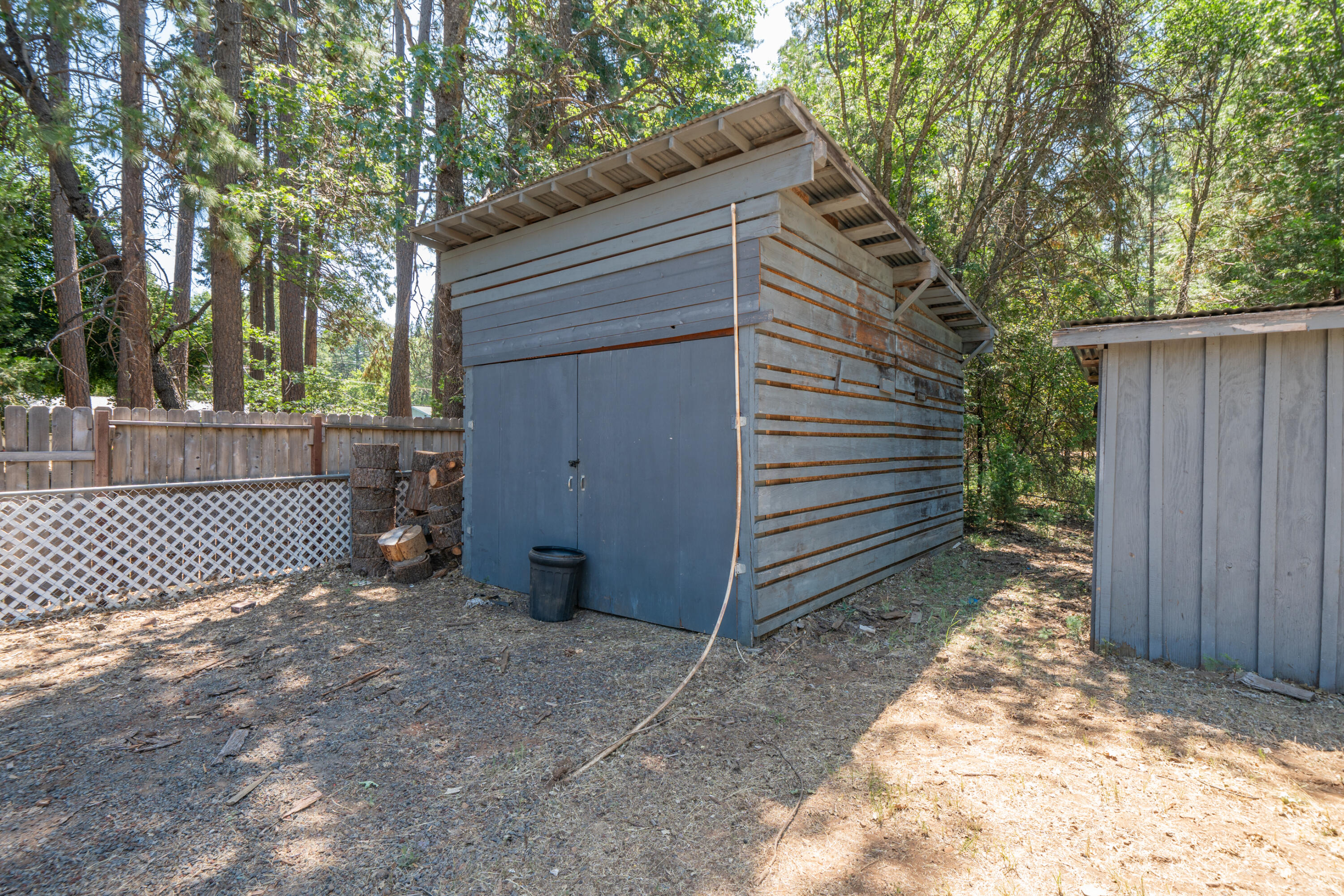 37347 Cypress Avenue Burney, CA 96013 - Photo 45 of 62 a view of a house with a small yard and a large tree