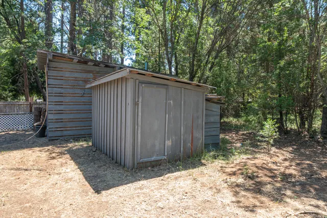 a view of a street with a car parked on the road