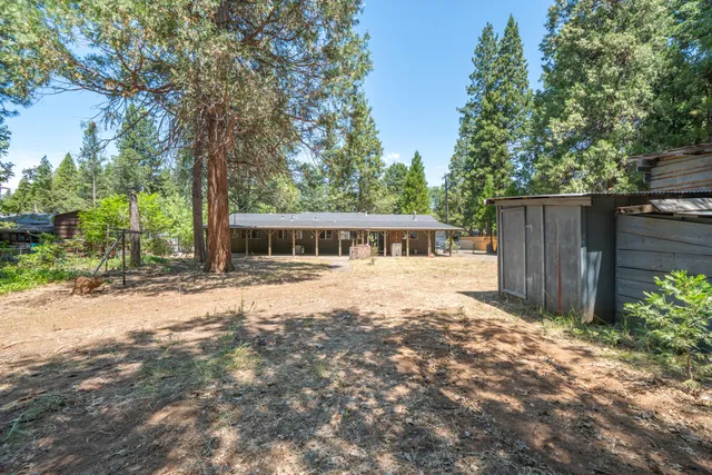 a house with trees in the background