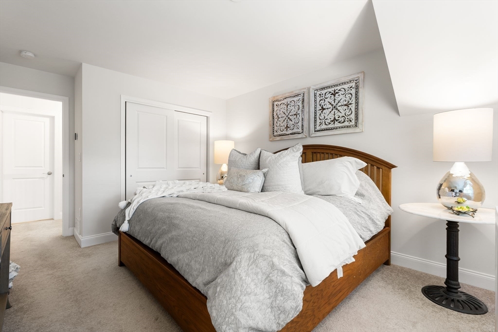 2 Hummingbird Way, Unit 1 Methuen, MA 01844 - Photo 26 of 42 a bedroom with bed and a window
