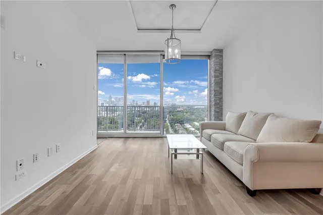 a living room with furniture and a window