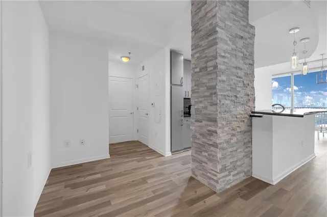 a view of a bathroom with a sink and a mirror