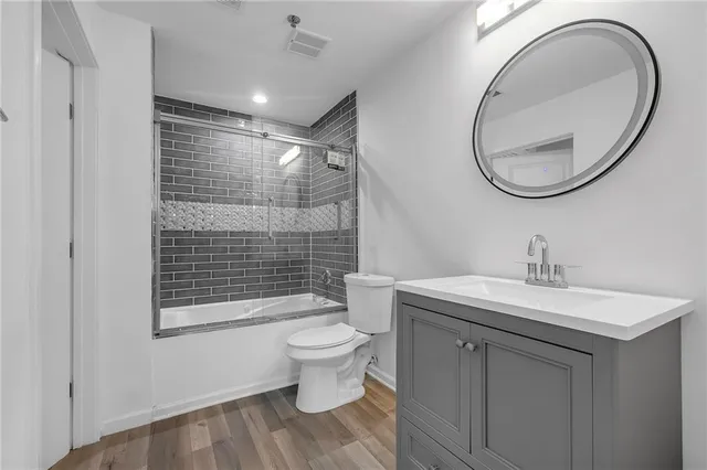 a bedroom with a large bed and a large window