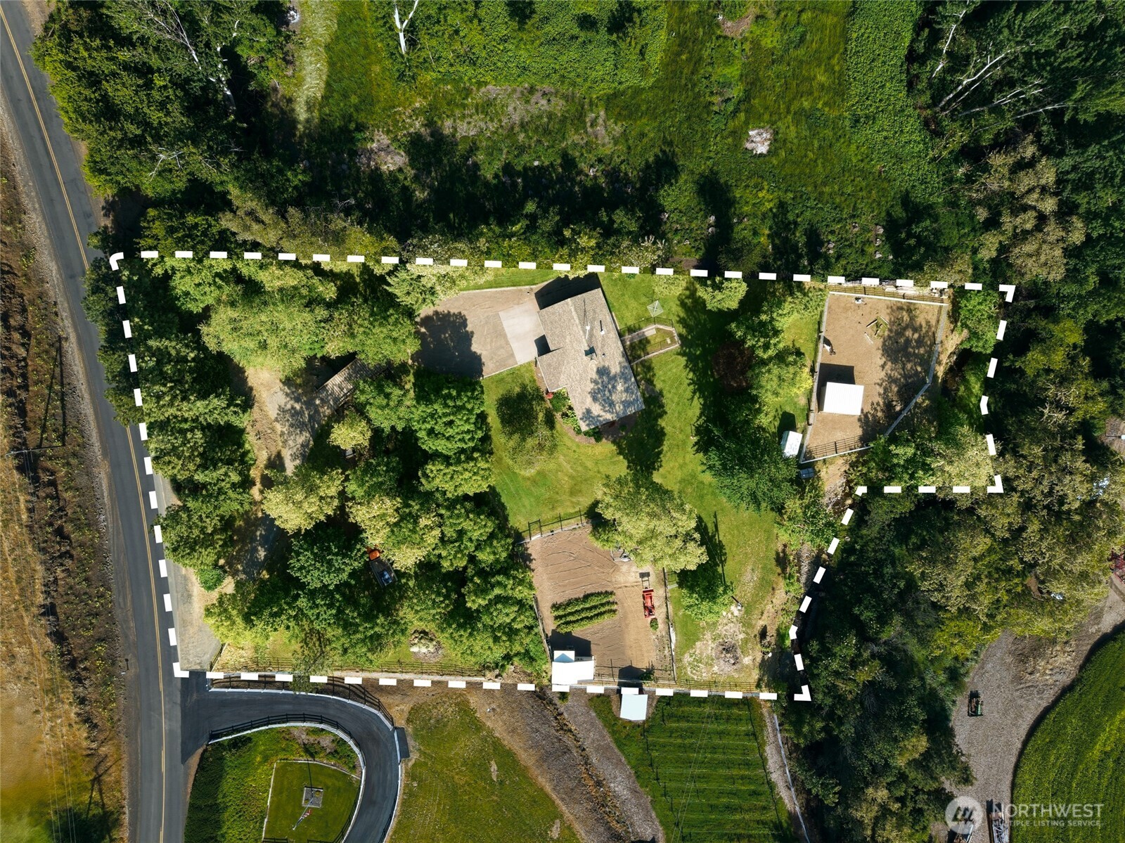 5834 Russell Creek Road Walla Walla, WA 99362 - Photo 4 of 38 a view of a yard with plants and large trees