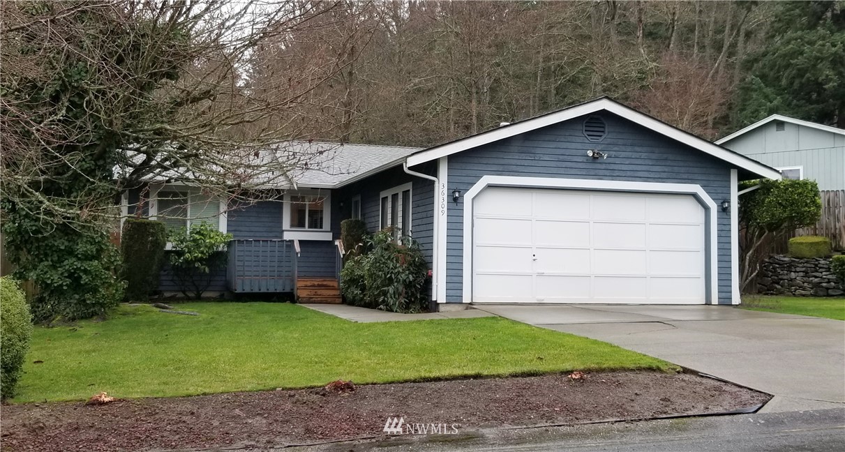 36308 25th Place South Federal Way, WA 98003 - Photo 1 of 27 a front view of house with a yard and garage