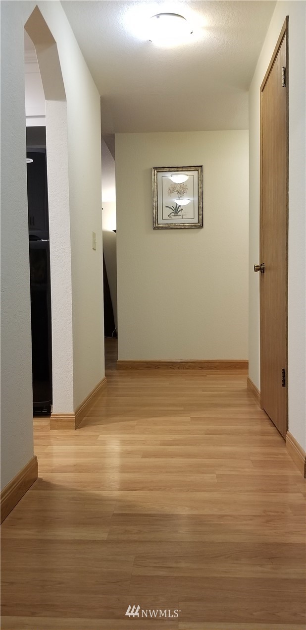 36308 25th Place South Federal Way, WA 98003 - Photo 2 of 27 a view of an empty room with wooden floor