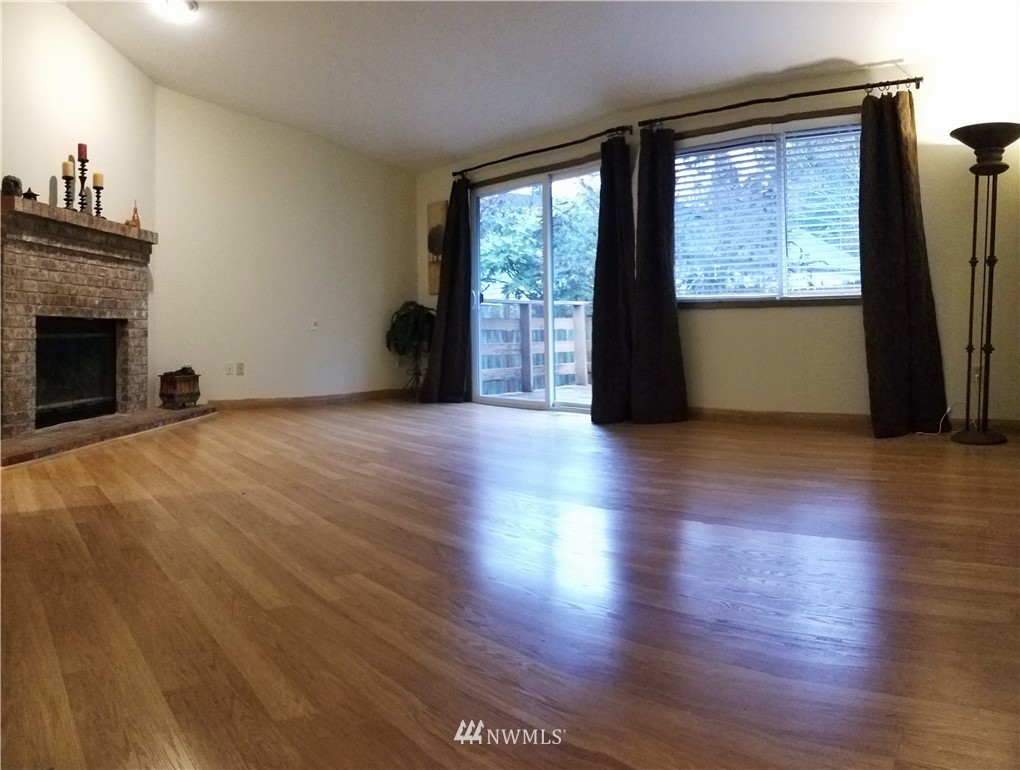 36308 25th Place South Federal Way, WA 98003 - Photo 11 of 27 a view of an empty room with wooden floor and a window