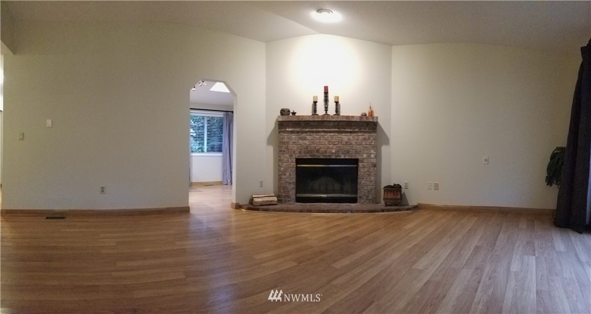 36308 25th Place South Federal Way, WA 98003 - Photo 12 of 27 a view of a livingroom with a fireplace and wooden floor
