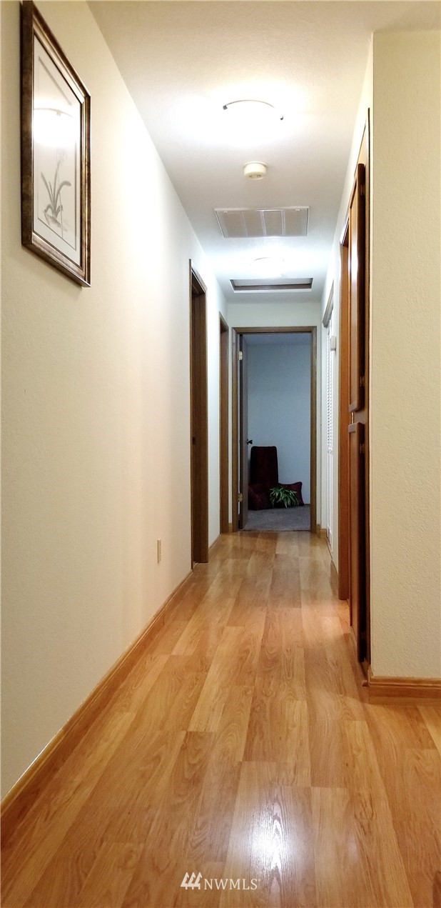 36308 25th Place South Federal Way, WA 98003 - Photo 14 of 27 a view of a hallway with furniture and a chandelier