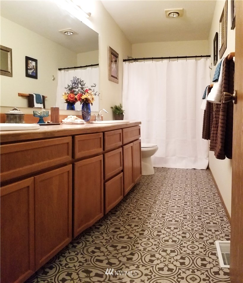 36308 25th Place South Federal Way, WA 98003 - Photo 15 of 27 a bathroom with a sink and a mirror