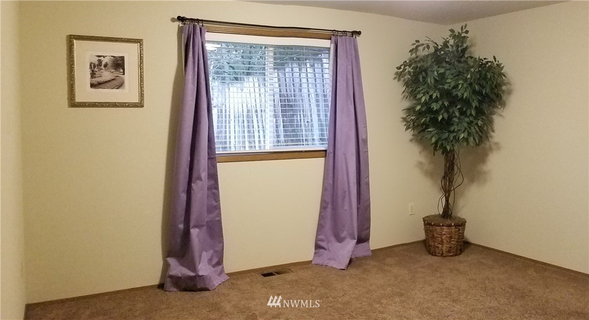 36308 25th Place South Federal Way, WA 98003 - Photo 17 of 27 a view of a room that has a plant and a window