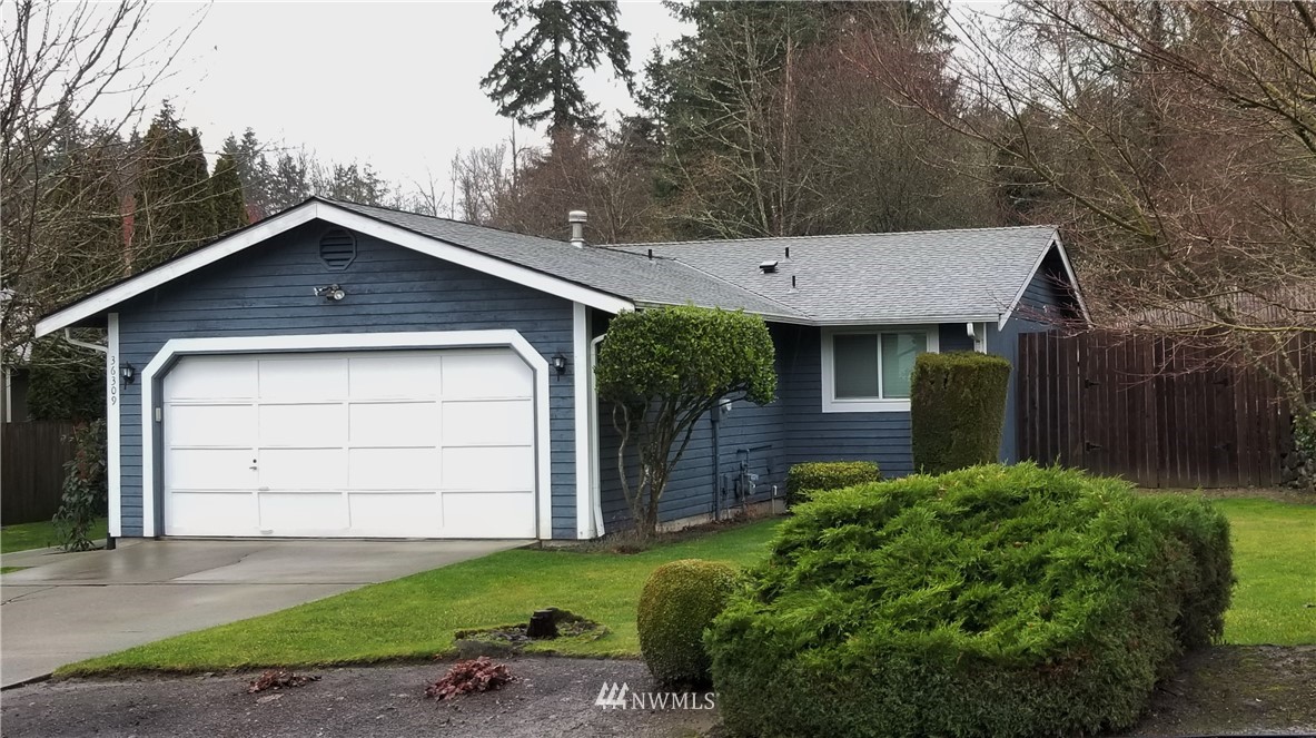 36308 25th Place South Federal Way, WA 98003 - Photo 27 of 27 a front view of a house with a yard and garage