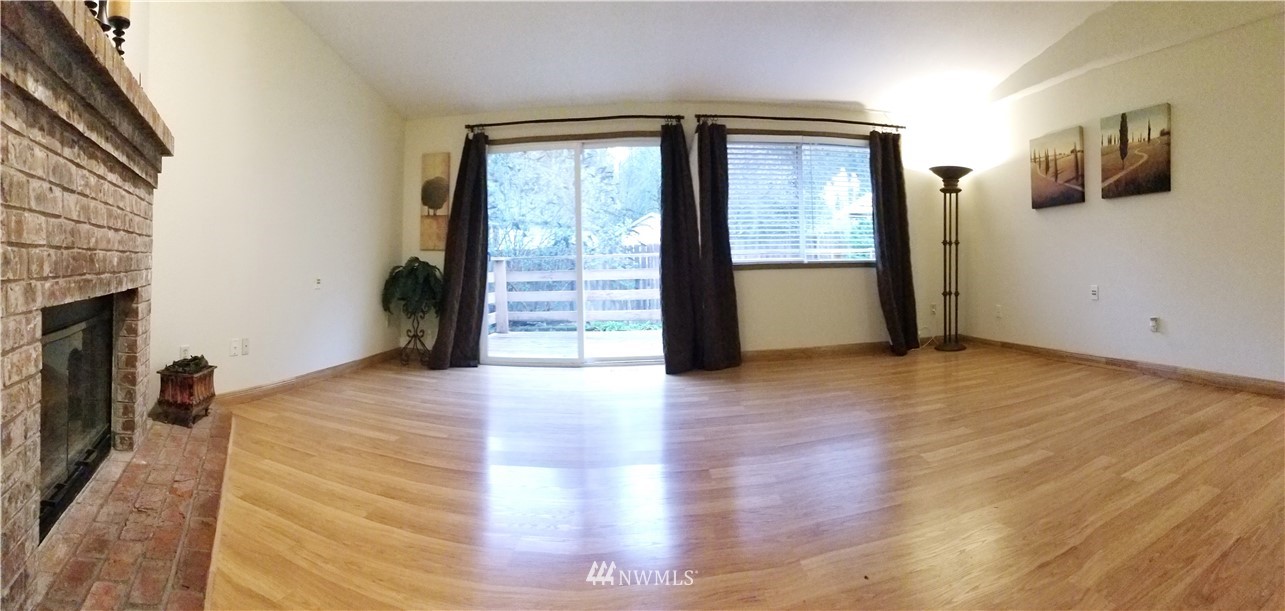 36308 25th Place South Federal Way, WA 98003 - Photo 9 of 27 a view of an empty room with wooden floor and a window