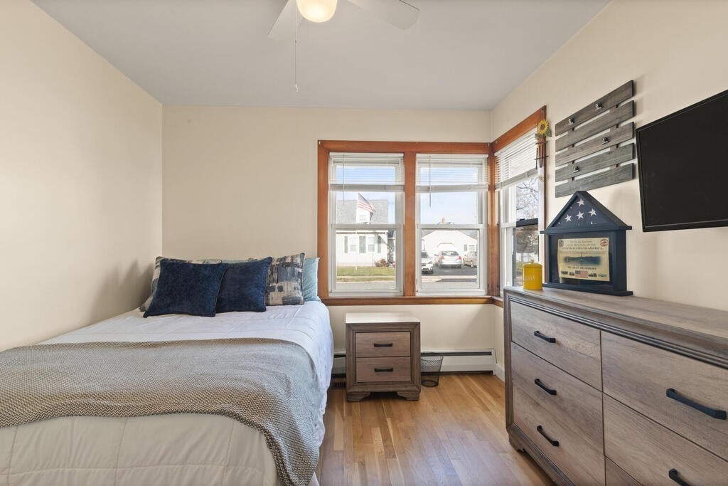 122 Gilman Street Nashua, NH 03060 - Photo 23 of 31 a bedroom with a bed and a large window