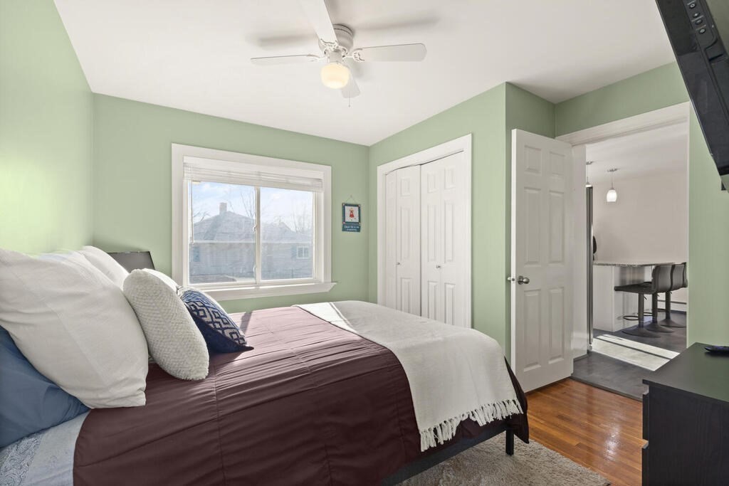 122 Gilman Street Nashua, NH 03060 - Photo 26 of 31 a bedroom with a large bed and a window