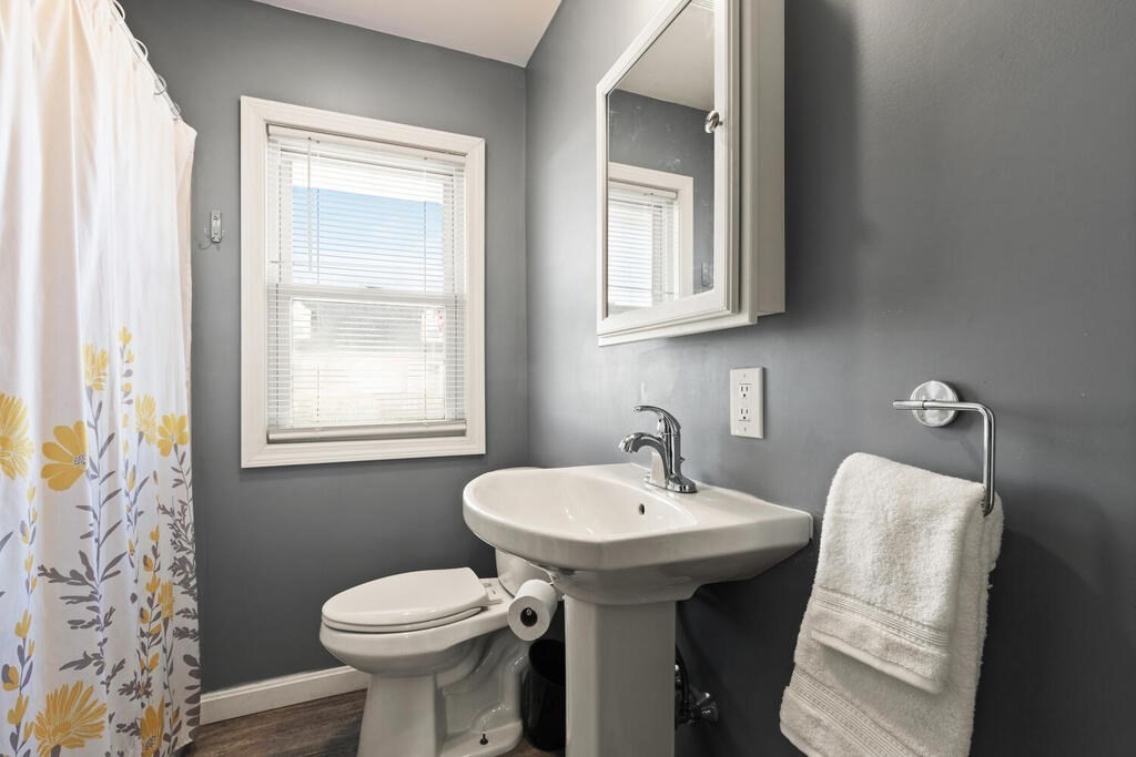 122 Gilman Street Nashua, NH 03060 - Photo 27 of 31 a bathroom with a sink toilet and mirror
