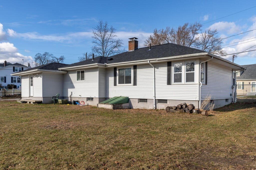 122 Gilman Street Nashua, NH 03060 - Photo 30 of 31 a front view of a house with a yard