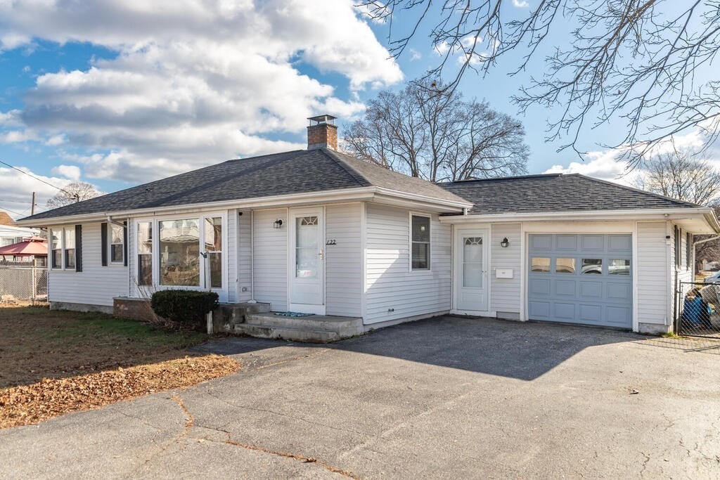 122 Gilman Street Nashua, NH 03060 - Photo 3 of 31 a front view of a house with a yard