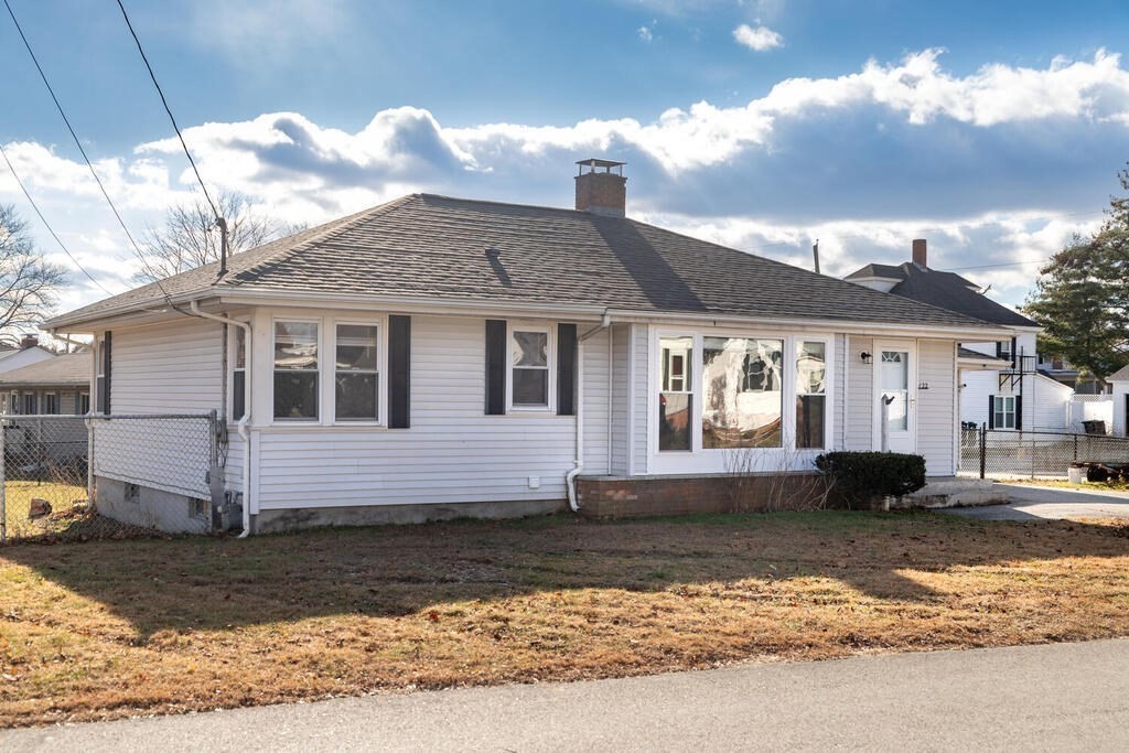 122 Gilman Street Nashua, NH 03060 - Photo 4 of 31 a front view of a house with a yard
