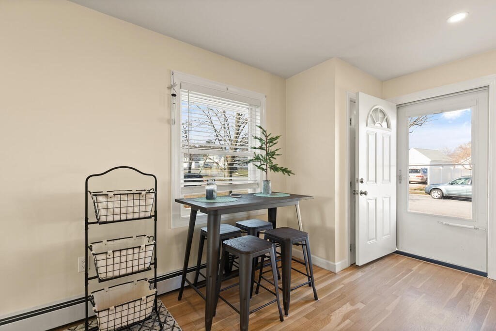 122 Gilman Street Nashua, NH 03060 - Photo 6 of 31 a view of a room with furniture and wooden floor