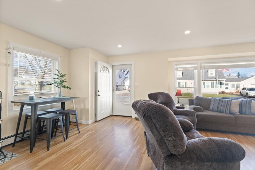 122 Gilman Street Nashua, NH 03060 - Photo 7 of 31 a living room with furniture and wooden floor
