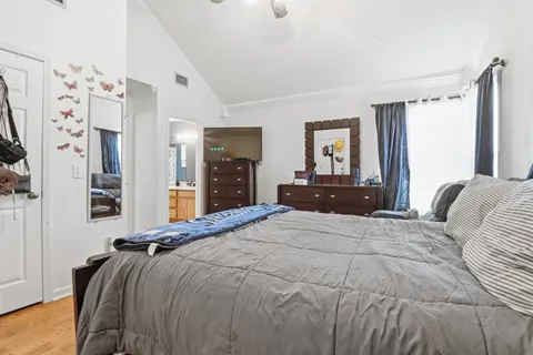 a bedroom with a bed and a couch