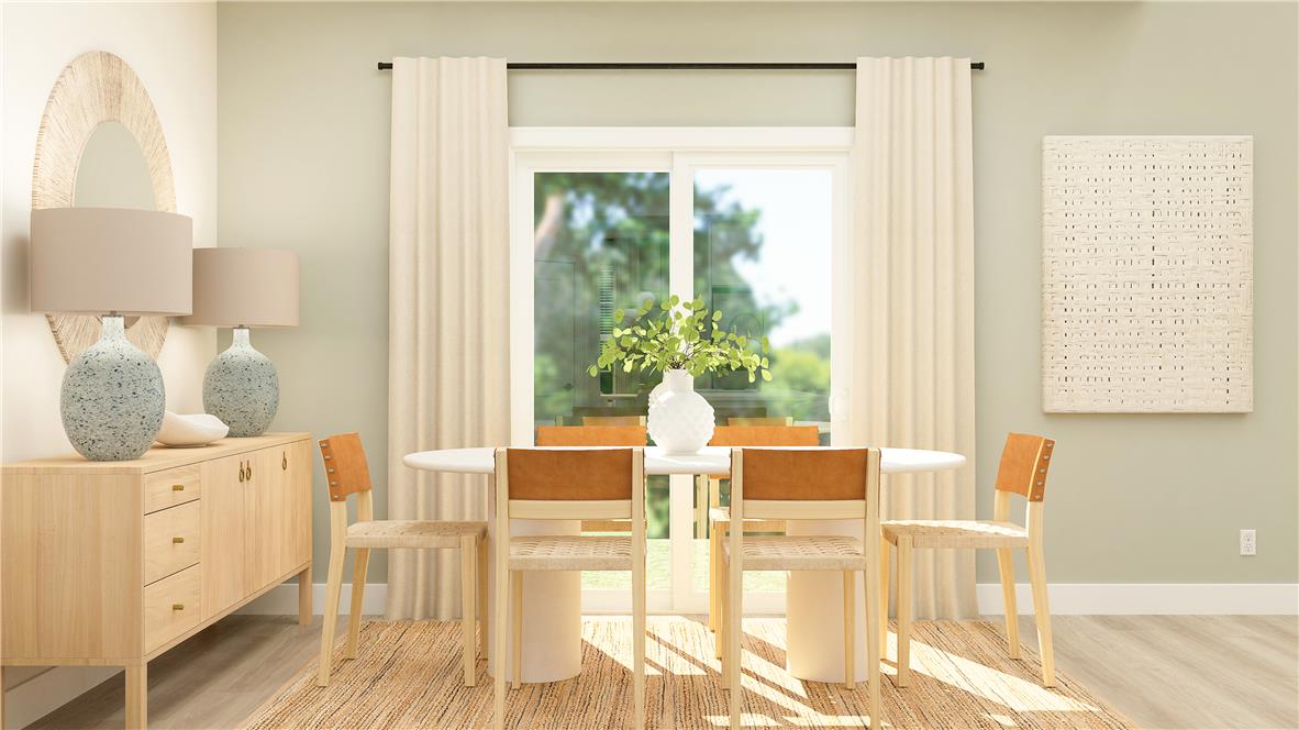 8445 Haaf Road Fogelsville, PA 18051 - Photo 10 of 28 A naturally illuminated dining area offers ample space for gathering, complemented by the warmth of hardwood flooring and clean lines.