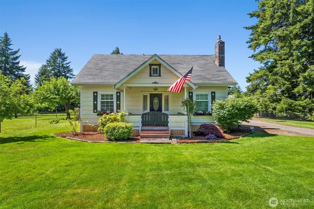 a front view of a house with a yard patio and fire pit