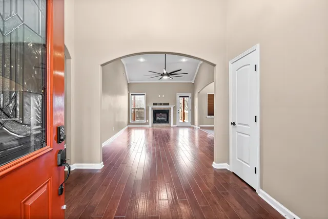 wooden floor in an empty room with a fireplace