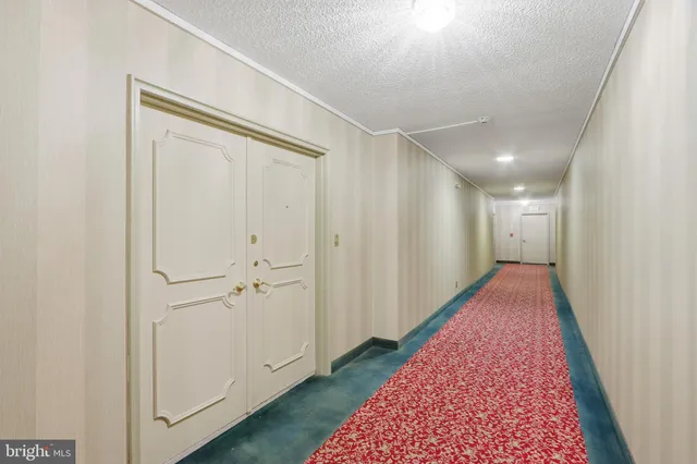 a view of hallway with closet