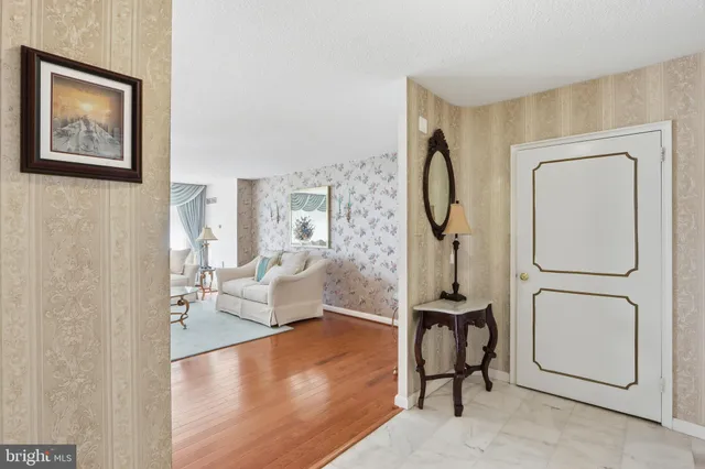 a view of a room with gym equipment and a large window