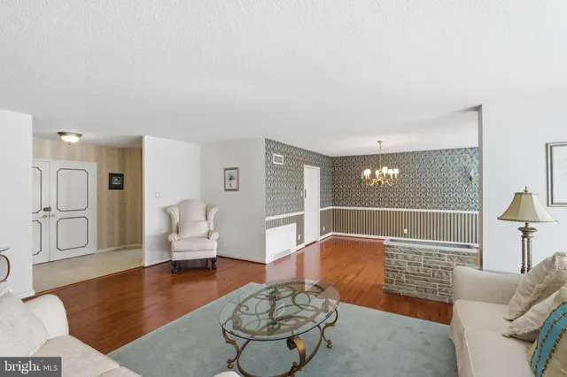 a living room with furniture and a rug