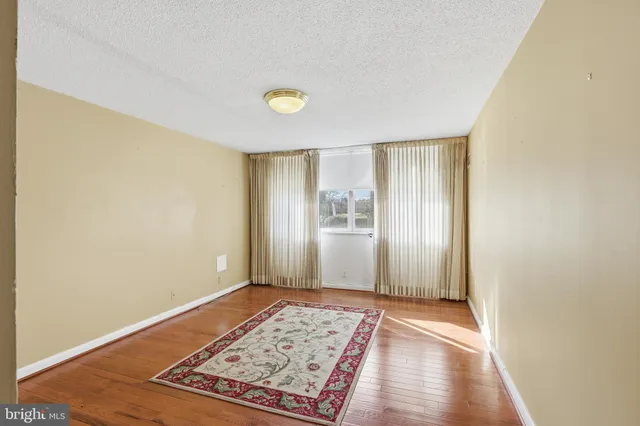 a view of an empty room and window