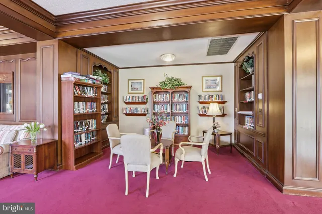 a view of a livingroom with furniture and workspace