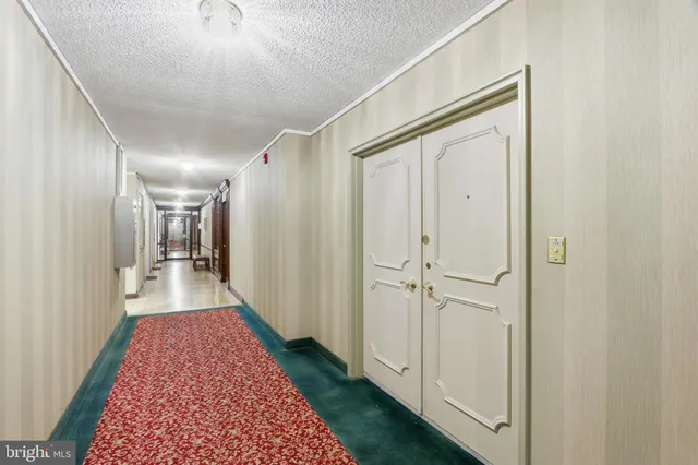 a view of a hallway with a white walls