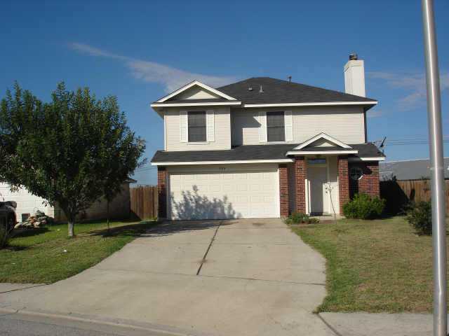 380 Keystone Loop Kyle, TX 78640 - Photo 1 of 1 a front view of a house with a yard and a garage
