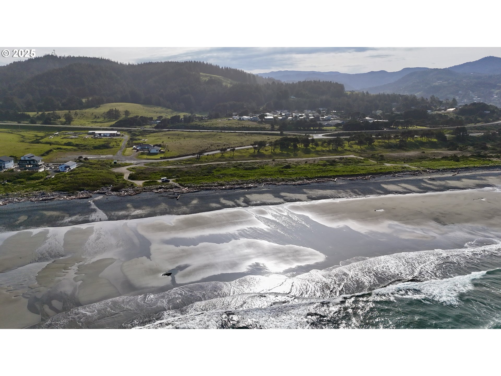 Old Coast Road Gold Beach, OR 97444 - Photo 18 of 26 a view of a town with mountains in the background