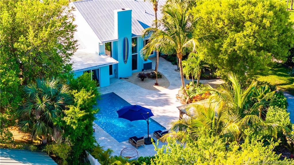 3713 Southeast Matanzas Street Stuart, FL 34996 - Photo 17 of 53 a view of a house with a yard