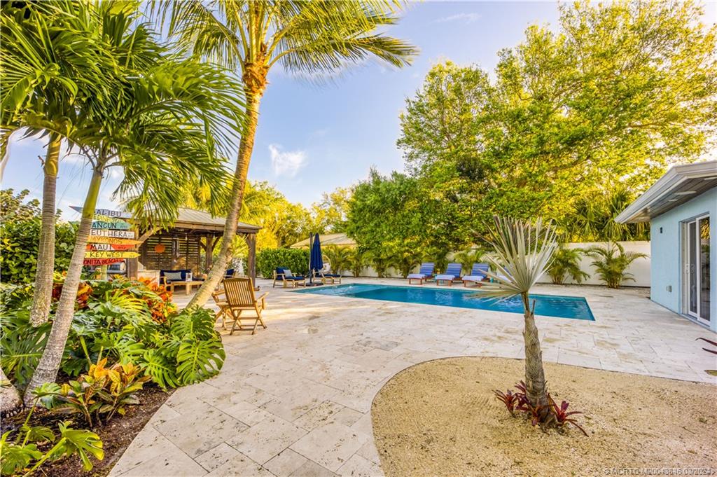 3713 Southeast Matanzas Street Stuart, FL 34996 - Photo 20 of 53 a view of a street with a building in the background