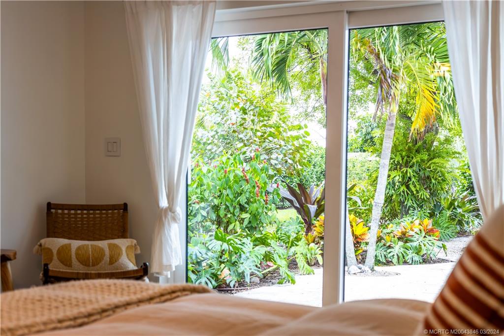 3713 Southeast Matanzas Street Stuart, FL 34996 - Photo 24 of 53 a bedroom with a bed and a window