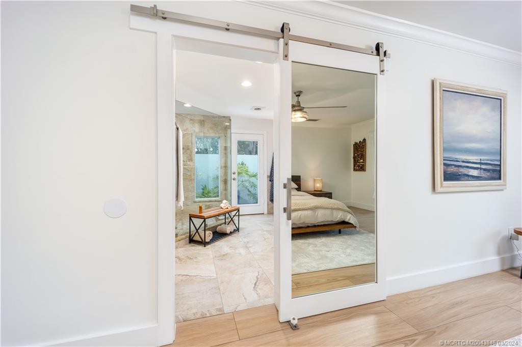 3713 Southeast Matanzas Street Stuart, FL 34996 - Photo 25 of 53 a en suite bathroom with a tub shower and bedroom view