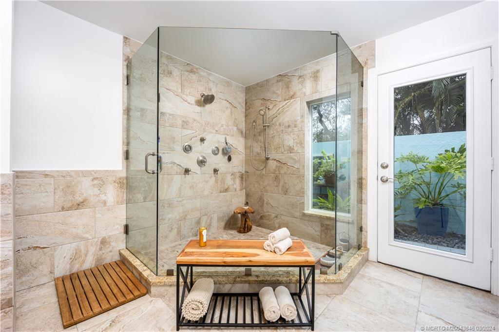 3713 Southeast Matanzas Street Stuart, FL 34996 - Photo 27 of 53 a view of a bedroom with a table and chairs