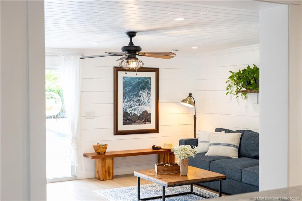 3713 Southeast Matanzas Street Stuart, FL 34996 - Photo 40 of 53 a living room with furniture and a window
