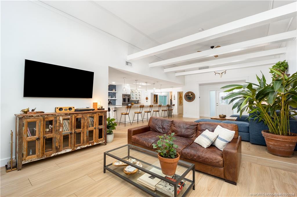 3713 Southeast Matanzas Street Stuart, FL 34996 - Photo 44 of 53 a living room with furniture and a flat screen tv