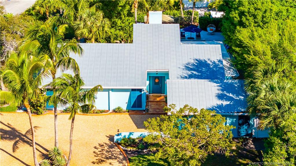 3713 Southeast Matanzas Street Stuart, FL 34996 - Photo 47 of 53 front view of a house with a yard