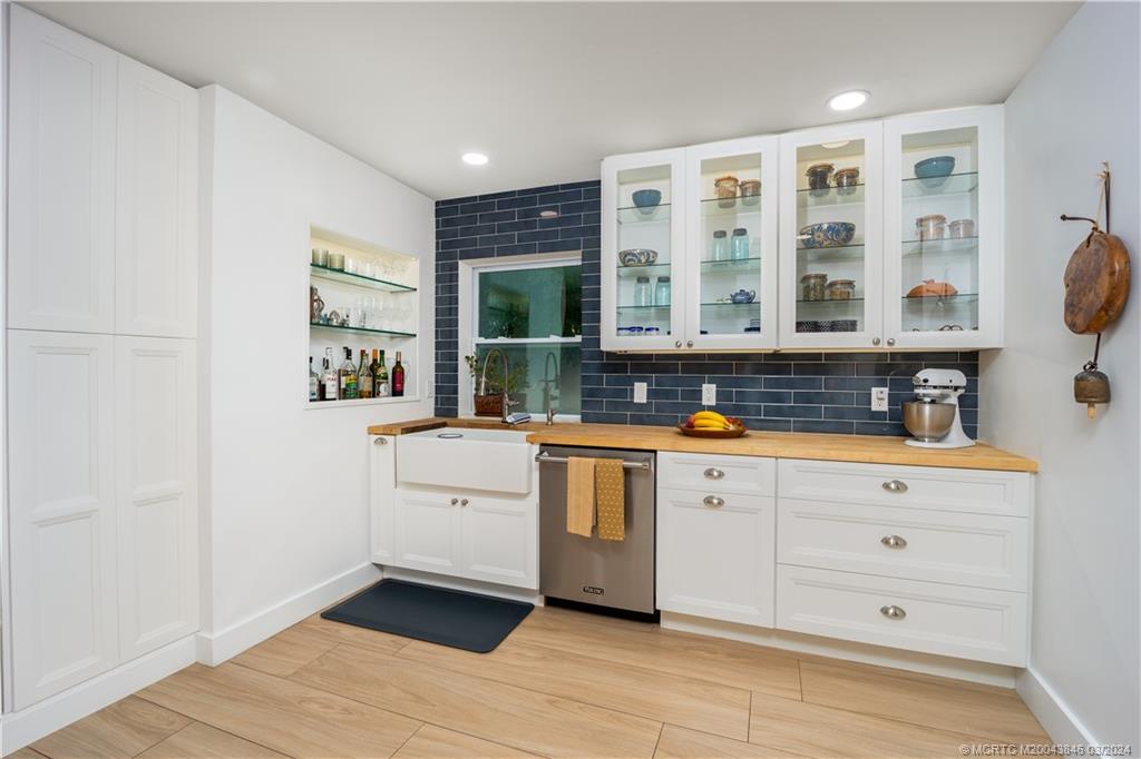 3713 Southeast Matanzas Street Stuart, FL 34996 - Photo 6 of 53 a kitchen with stainless steel appliances granite countertop a stove and a sink